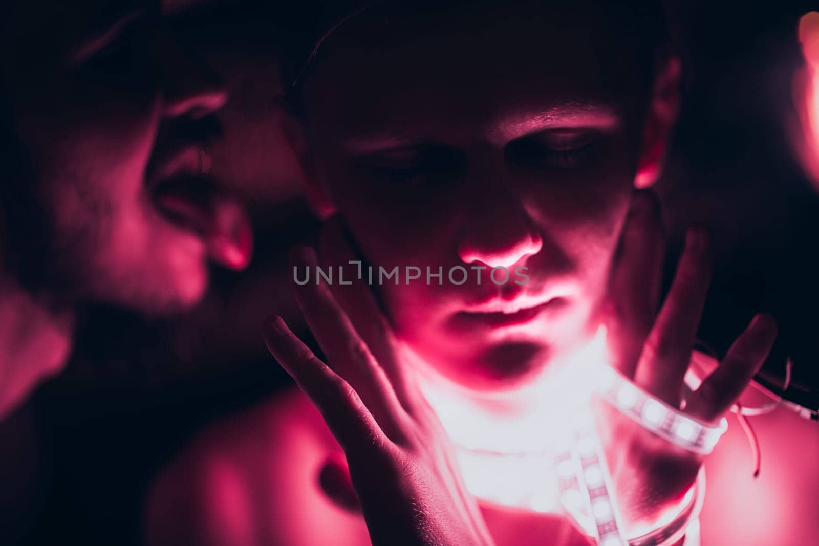 Portrait man Strip Light LED tape on dark color background.