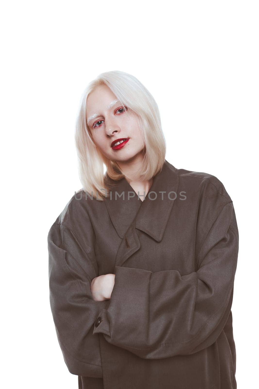 portrait of an albino girl in a raincoat in the studio.