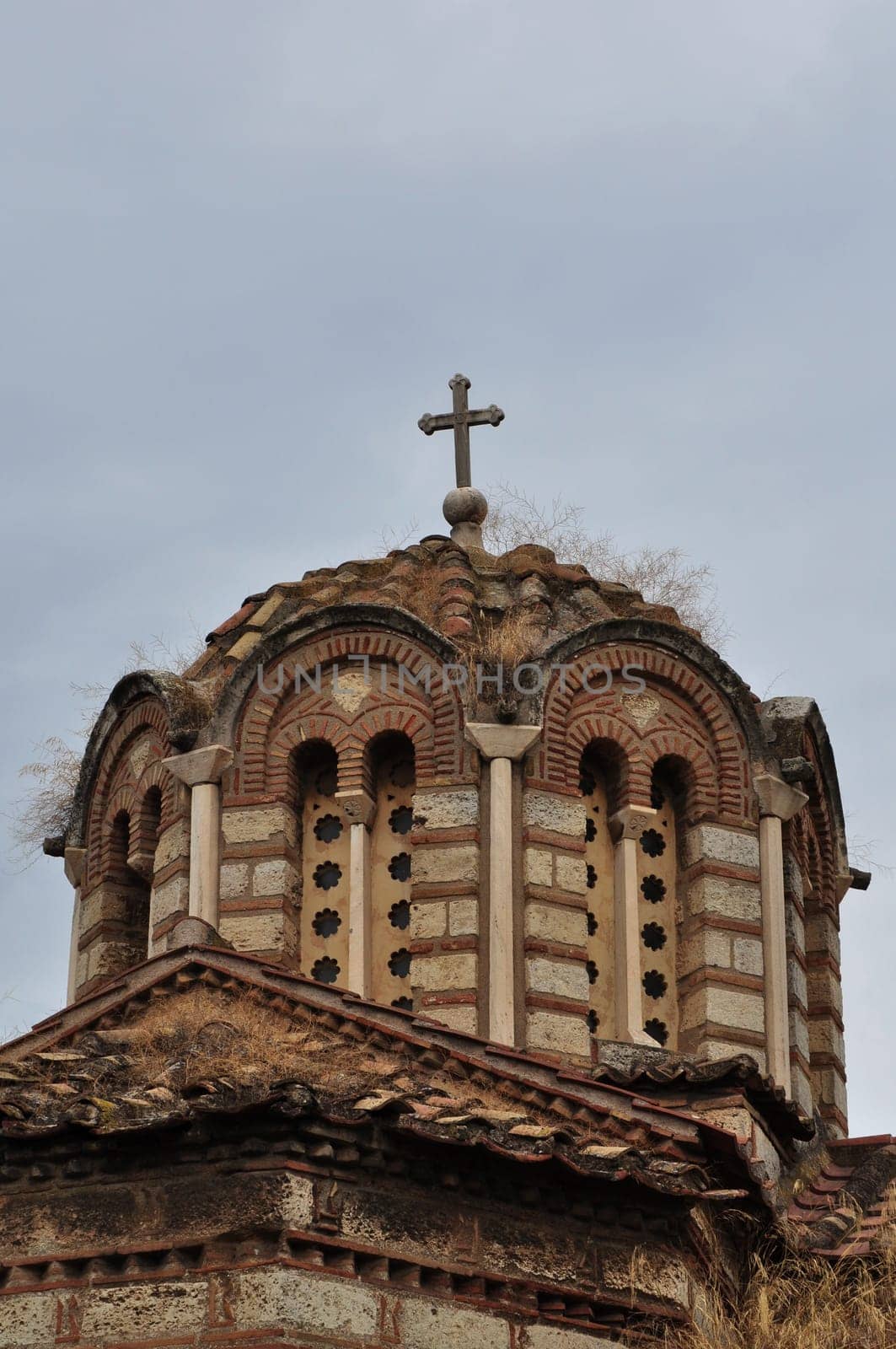 Detail of byzantine church dome exterior with arched windows. Ancient agora of Athens, Greece.