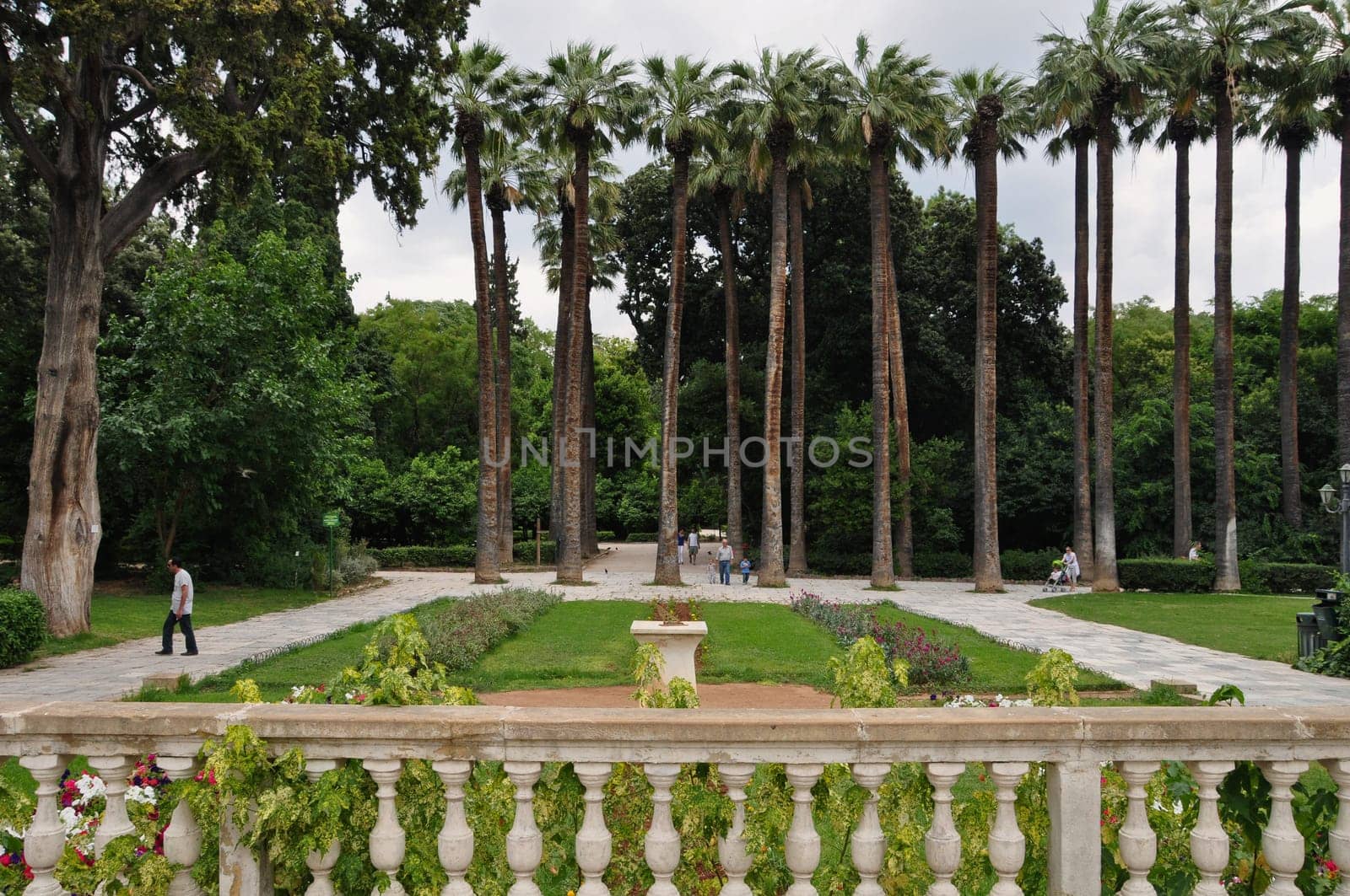 ATHENS, GREECE - JUNE 9, 2014: People walking on the National Garden public park in central Athens, Greece.