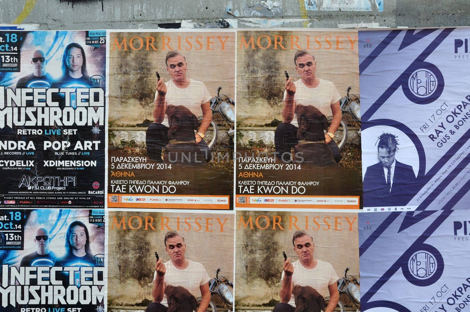 ATHENS, GREECE - OCTOBER 15, 2014: Wall with live music concert posters indie rock by Morrissey and dj sets of minimal techno by Ray Okpara and psychedelic trance by Infected Mushroom.