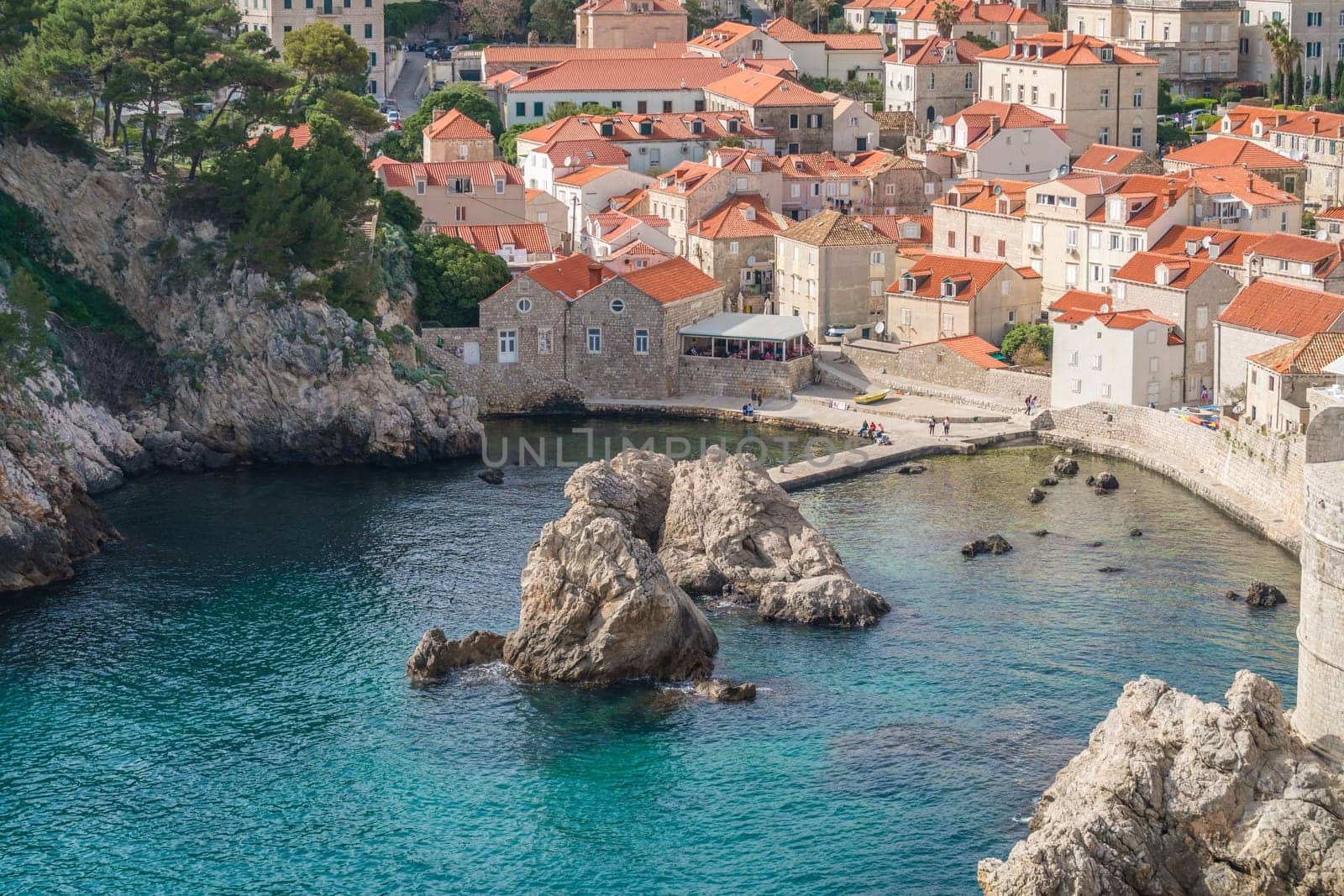 Dubrovnik, Croatia - April 2018 : Rocky bay and boat landing in Dubrovnik Old Town