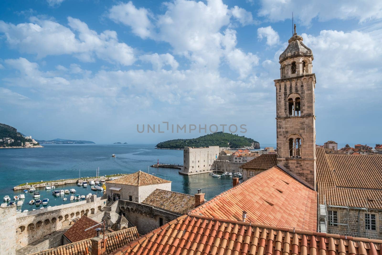 Dubrovnik, Croatia - April 2018 : Church bell tower and rooftops of old houses in Dubrovnik, viewed from the Old Town fortified walls