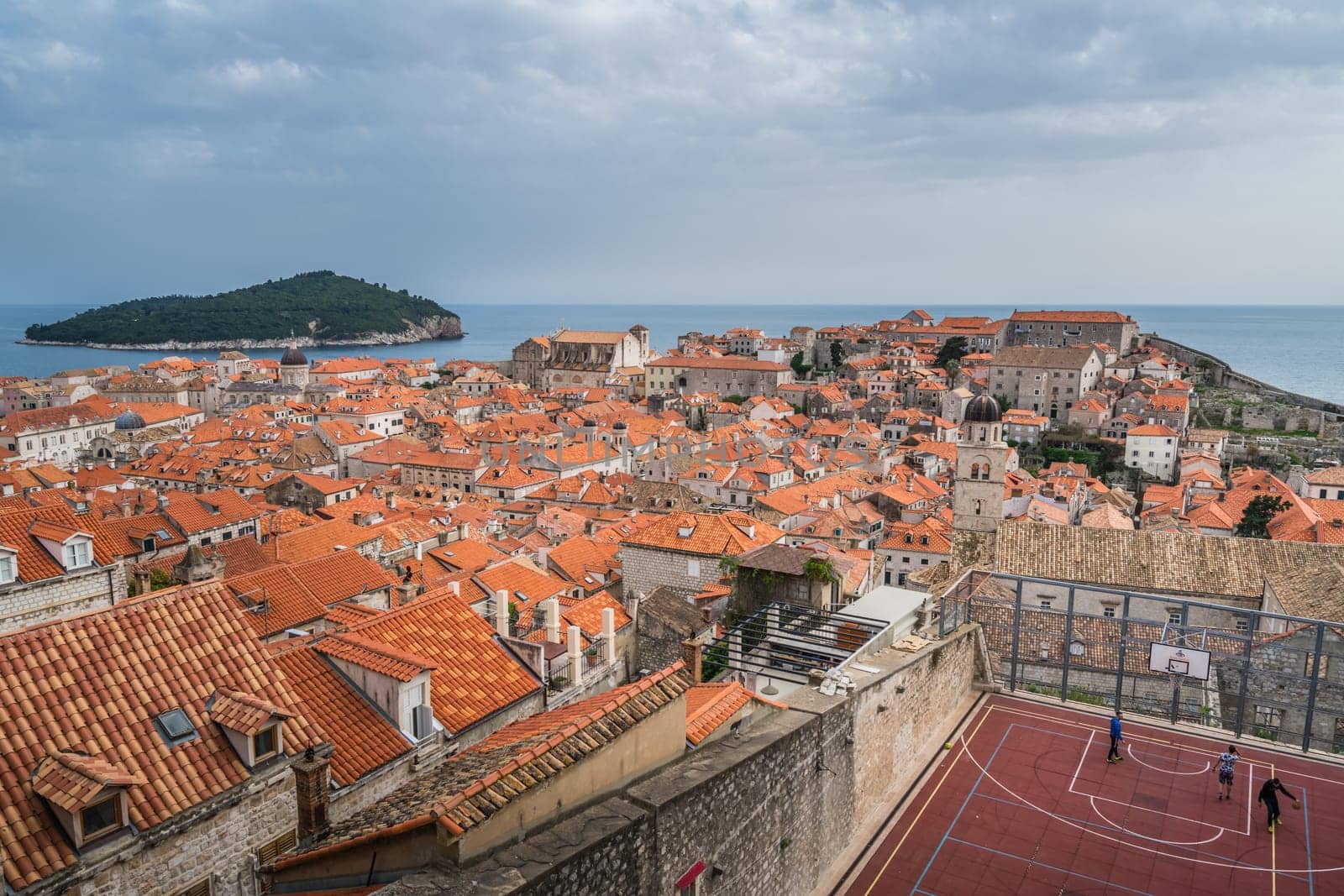 Dubrovnik, Croatia - April 2018 : Basketball pitch in front of the old houses and buildings in Dubrovnik, viewed from the Old Town fortified walls