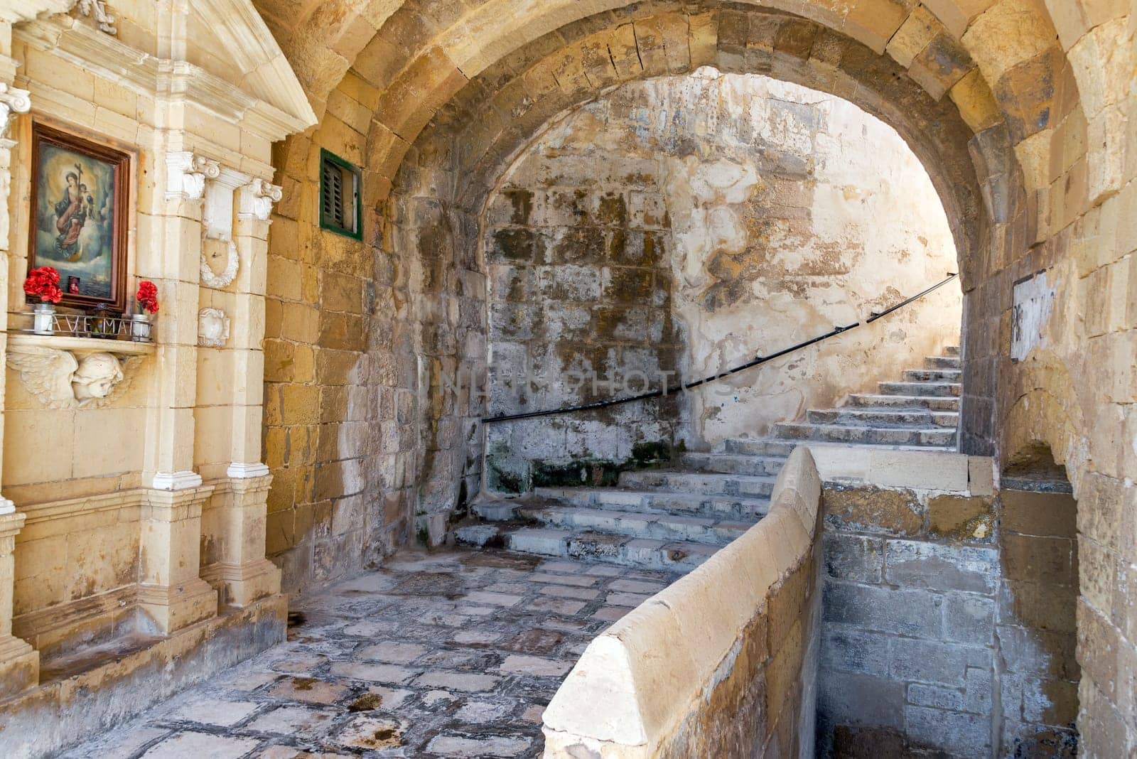 Old medieval stone passage way in historic Senglea, Malta