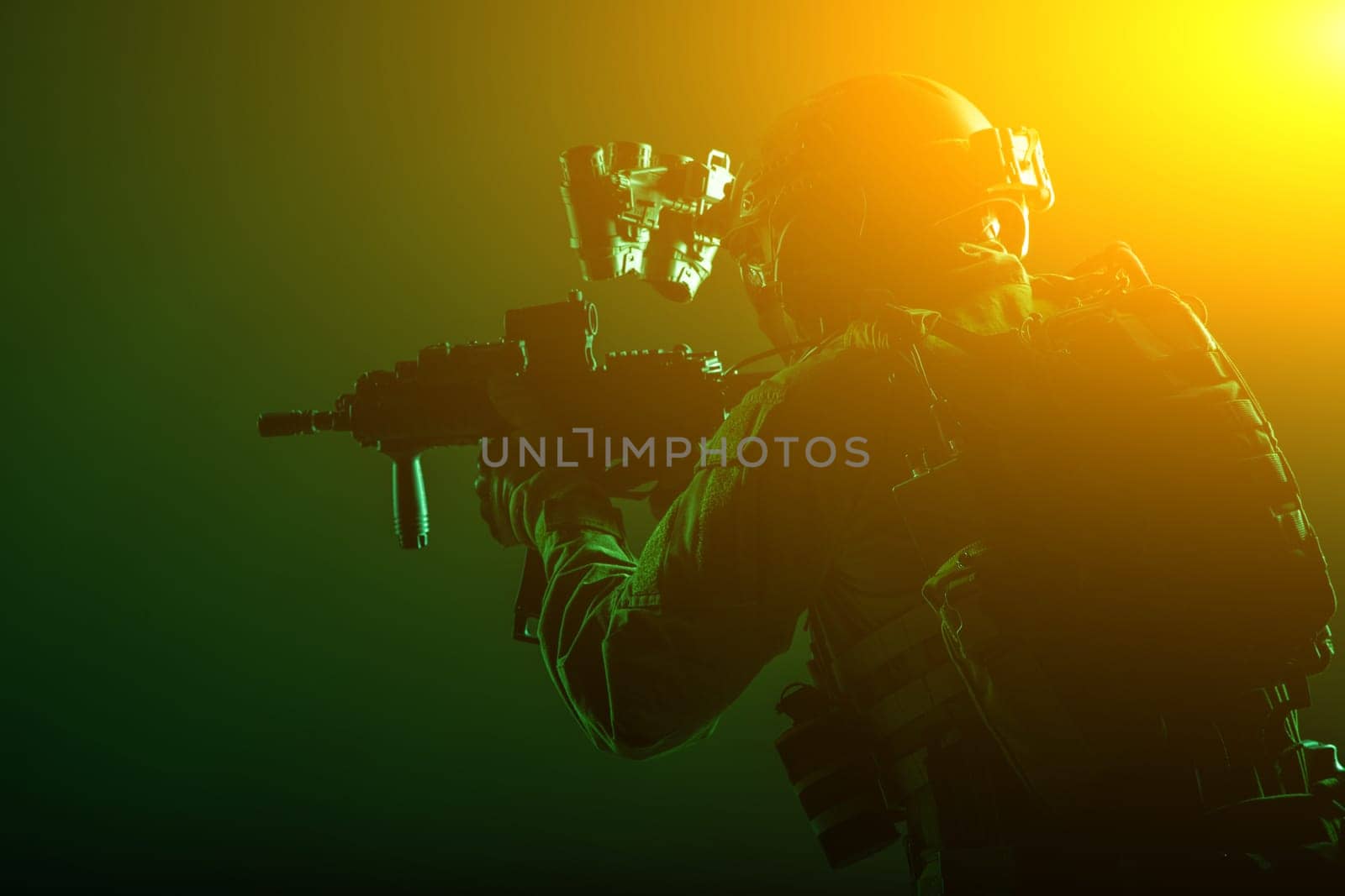 Army soldier, counter terrorist squad fighter, military company mercenary in ammunition and body armor, helmet with night vision device, aiming with short barrel service rifle, low key, studio shoot