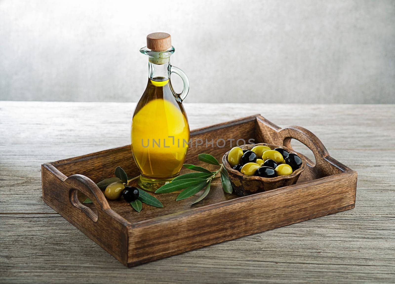 Bottle of Extra virgin healthy Olive oil with fresh olives. Concept of nature and healthy food