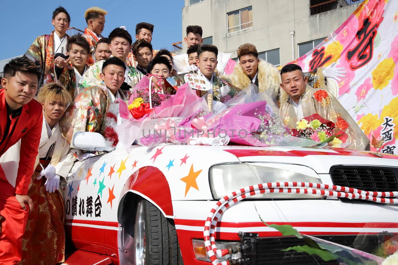 KAGAWA, JAPAN - JANUARY 13, 2019: Young Japanese men wearing traditional kimono for the coming of age day celebration, they turn twenty (seijinsiki, seijinshiki) in Kagawa, Japan.