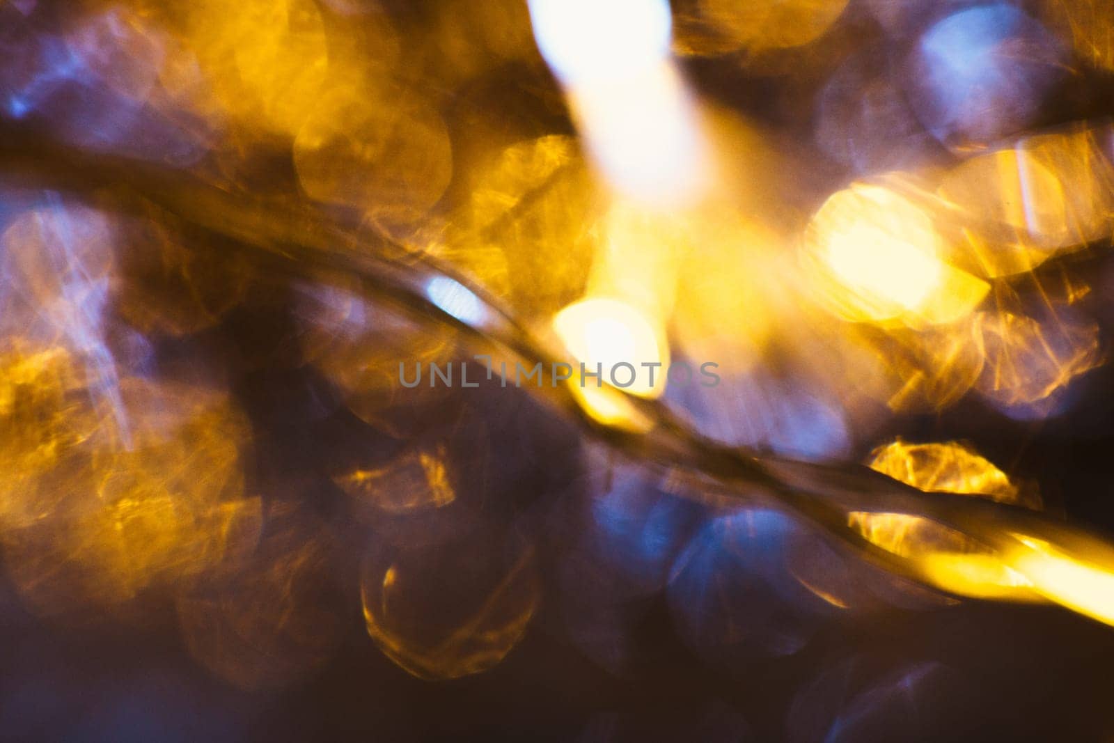 gold and silver bokeh on a dark background.