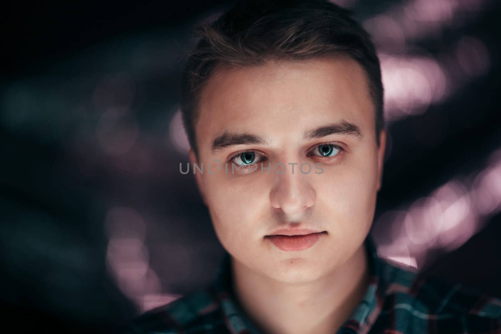 portrait of a young man on a blurred background.