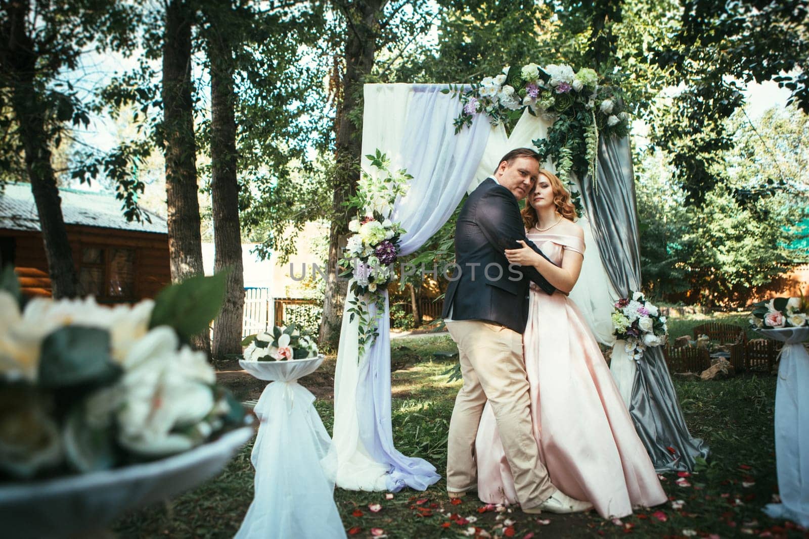 bride and groom on wedding ceremony on background nature.