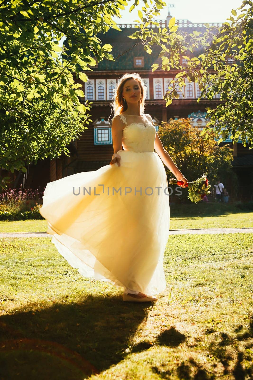beautiful young bride in the garden background.