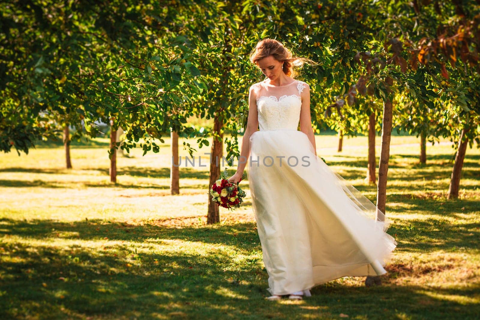 happy young bride on autumn forest background.