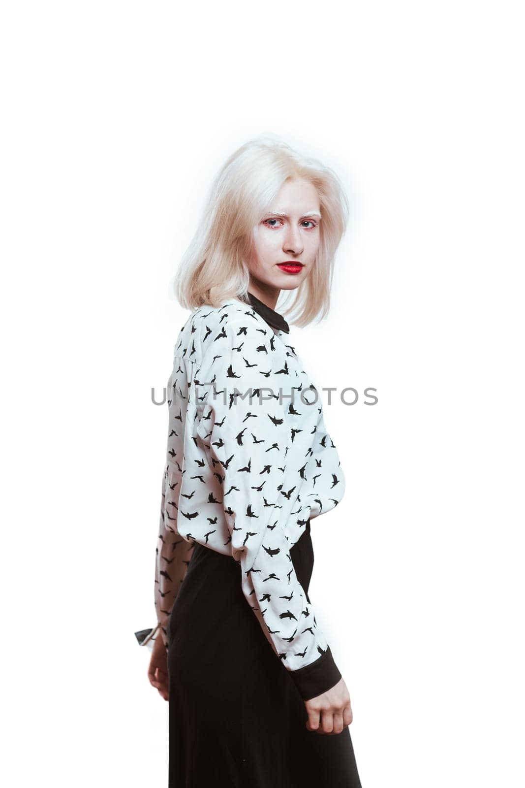 portrait blonde albino girl in studio on white background.