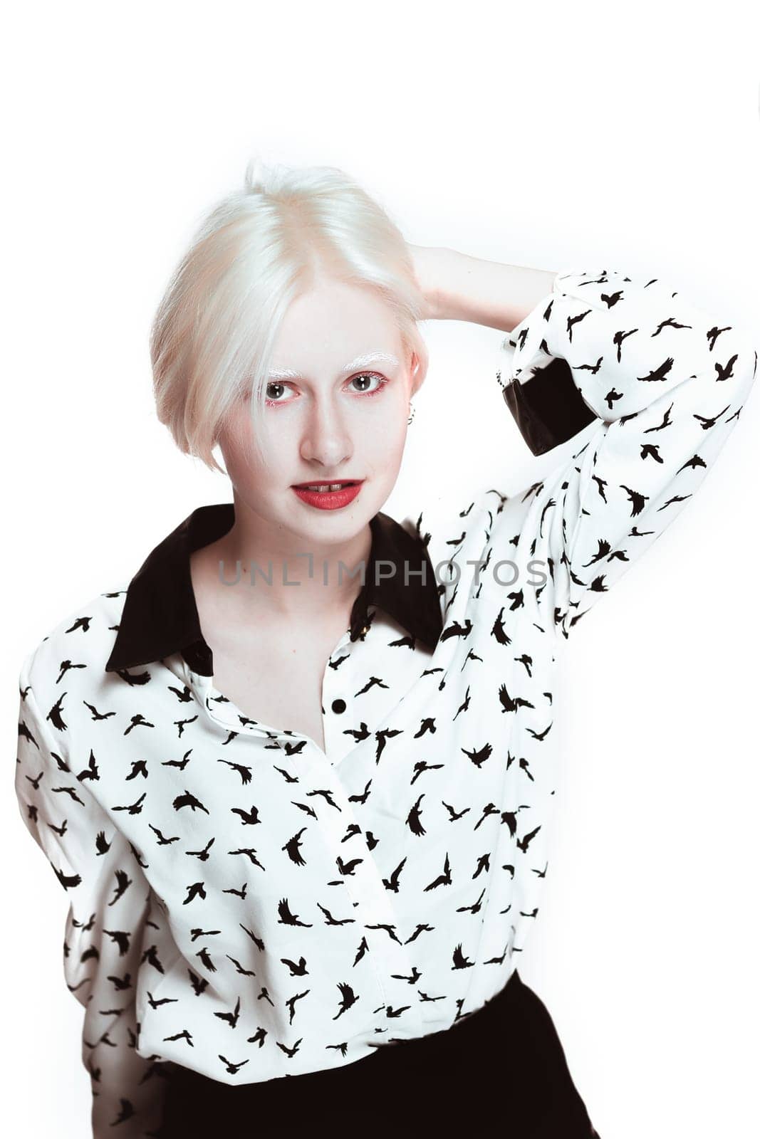 portrait of blonde albino girl in studio.