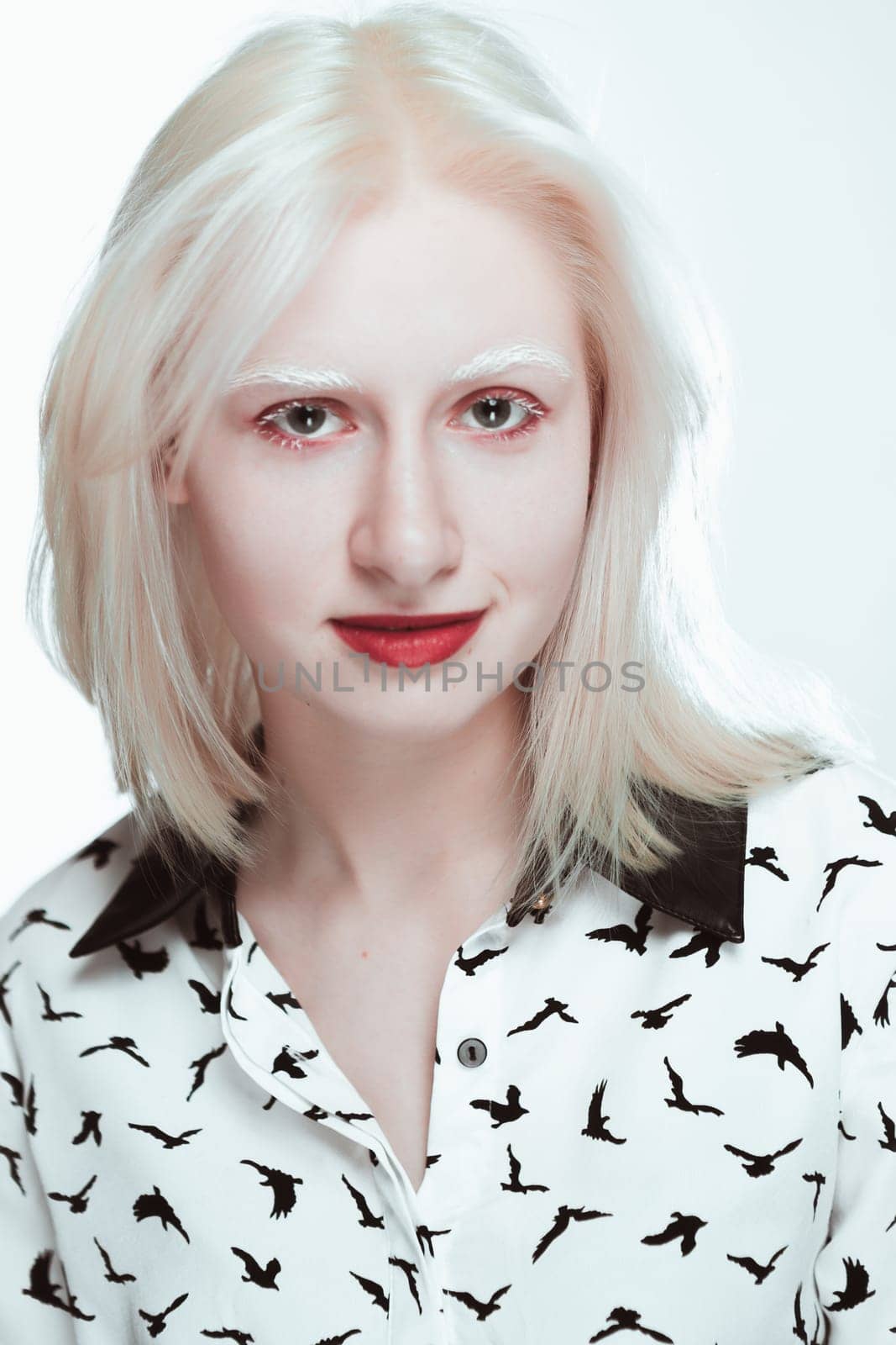 portrait of blonde albino girl in studio.