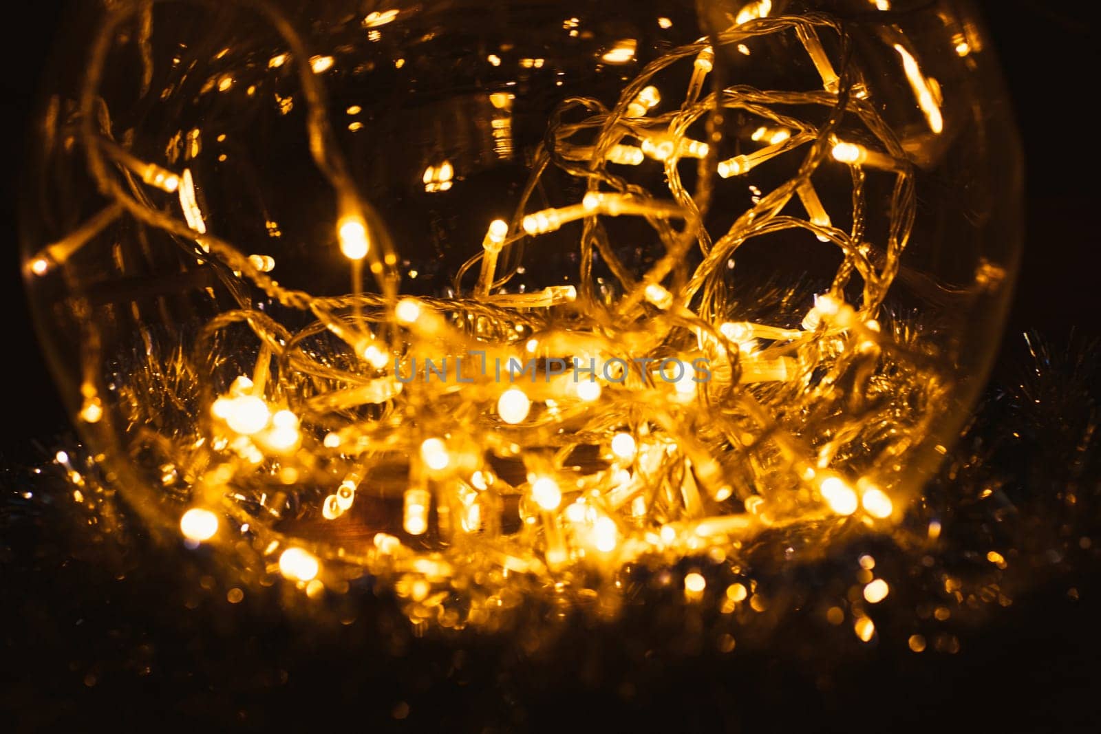 Christmas luminous garland on a dark background.