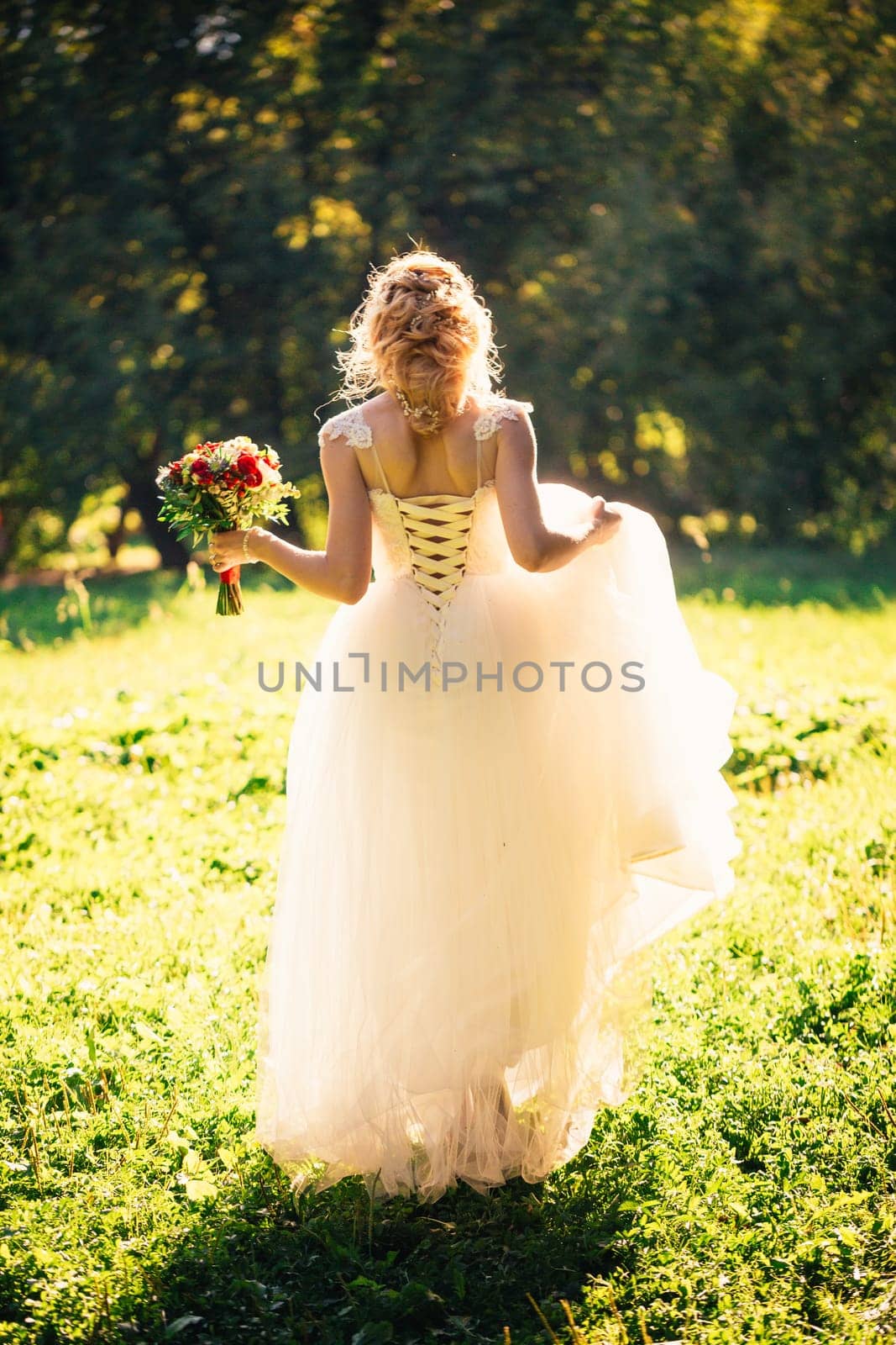beautiful young bride in the garden background.