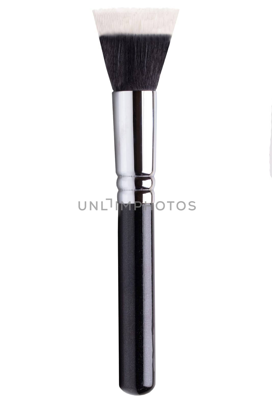 Selective focus on black clean professional makeup brush isolated on white. Concept beauty. Macro.