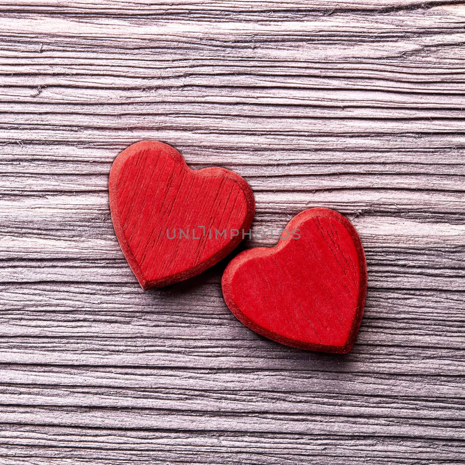 Two decorative hearts on a dark wooden background with copy space. top view. Valentine's Day card. Design element for romantic greeting card, wedding invitation