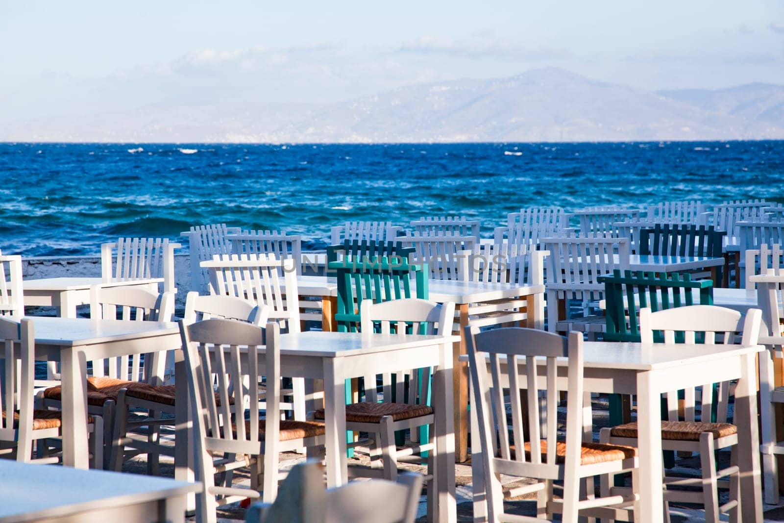 restaurant chairs and tables by the sea