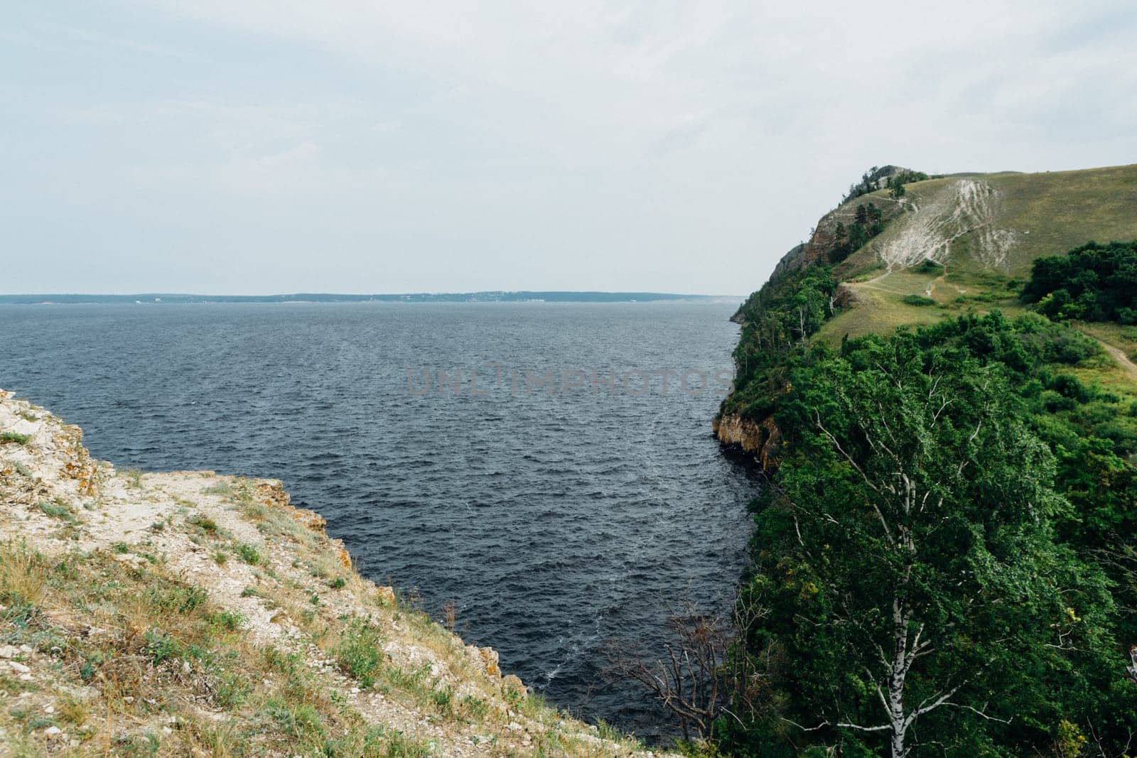 landscape river cliff grass on the sky background.