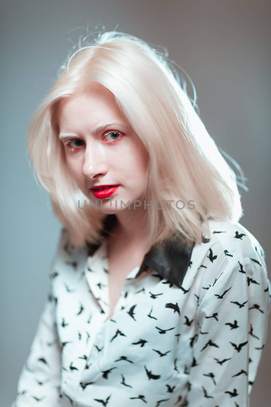 portrait of blonde albino girl in studio.