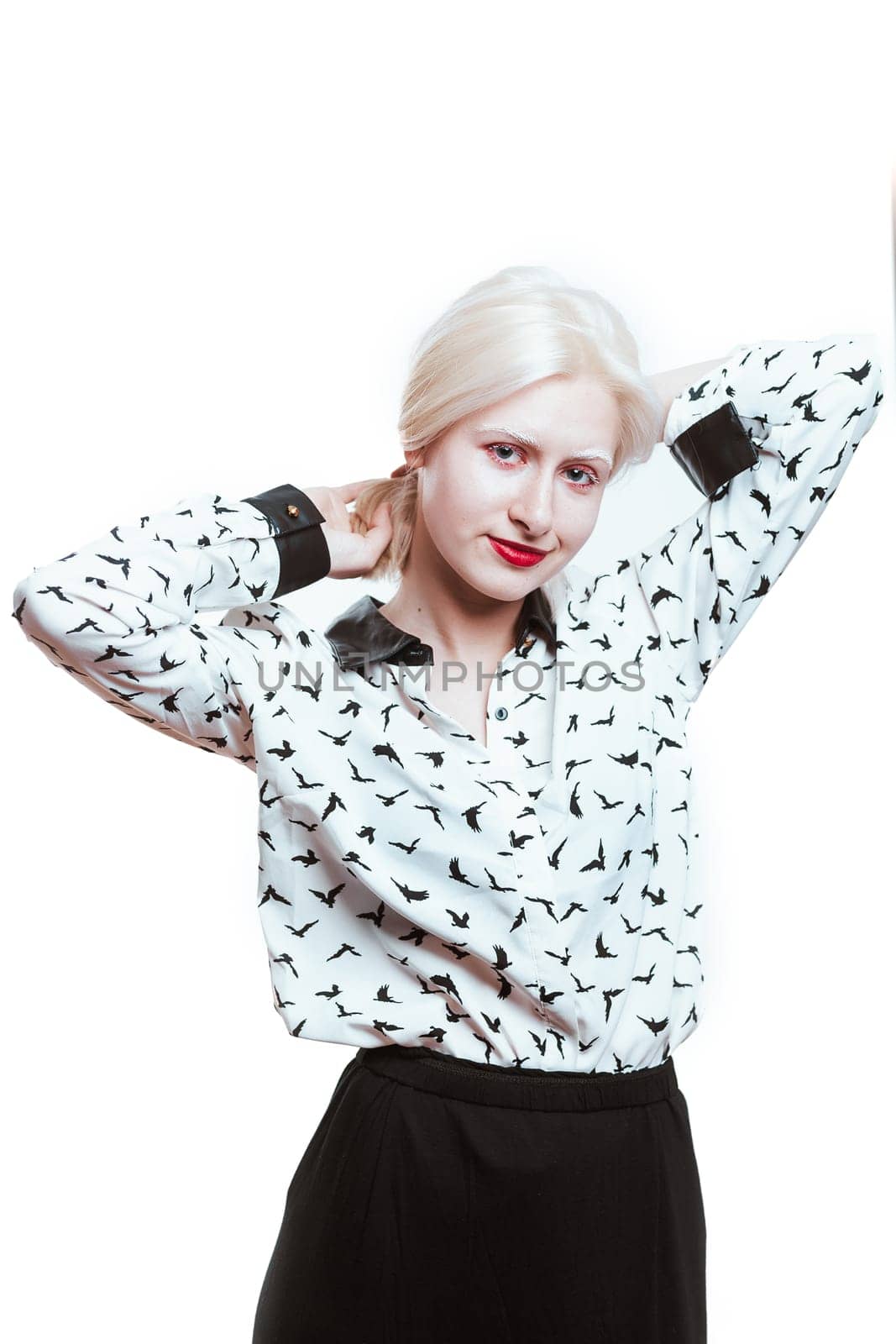 portrait blonde albino girl in studio on white background.