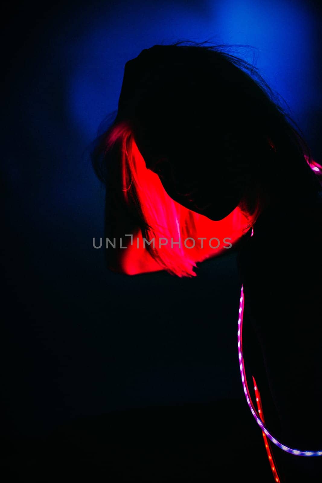 Portrait girl Strip Light LED tape on dark color background.