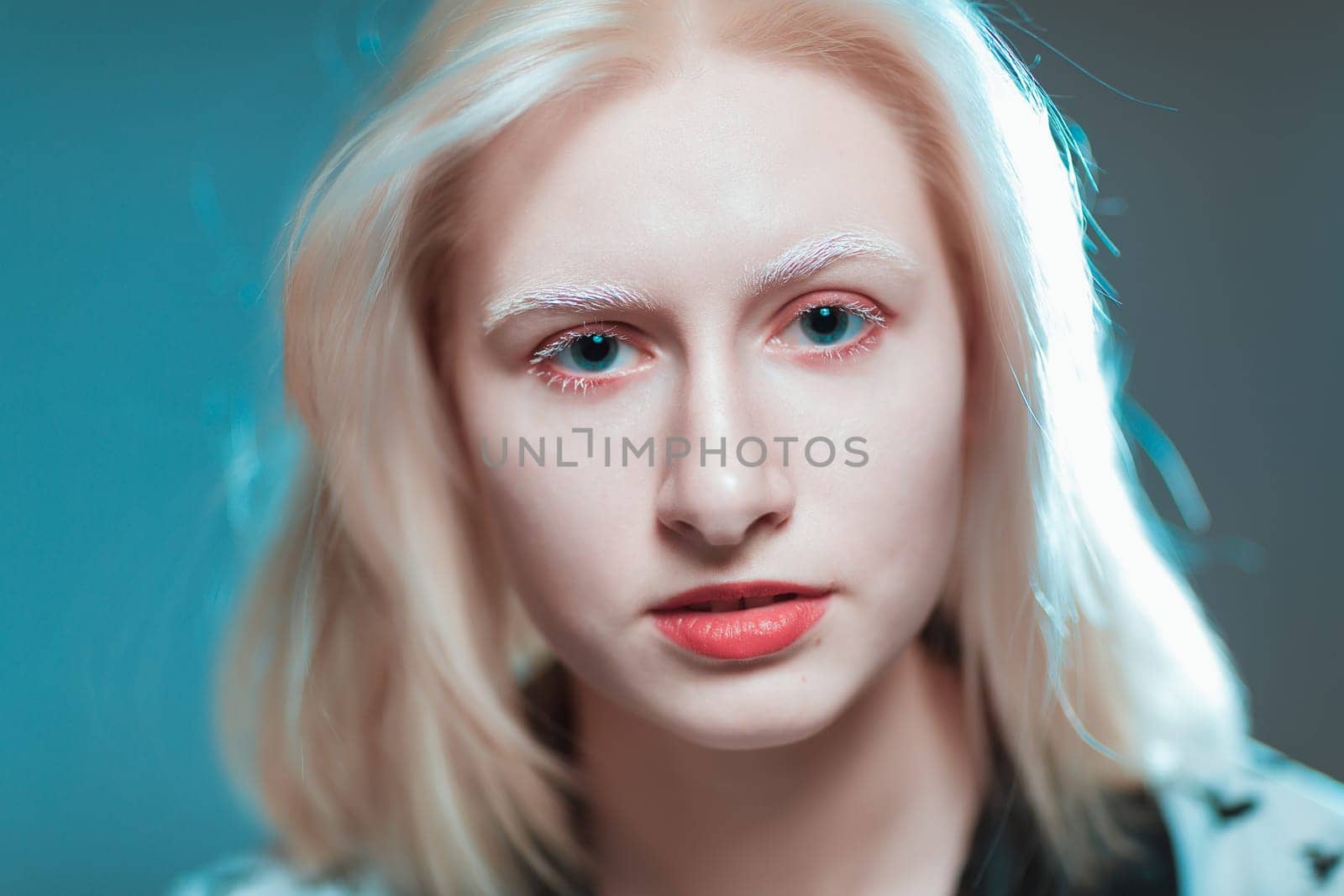 portrait of blonde albino girl in studio.