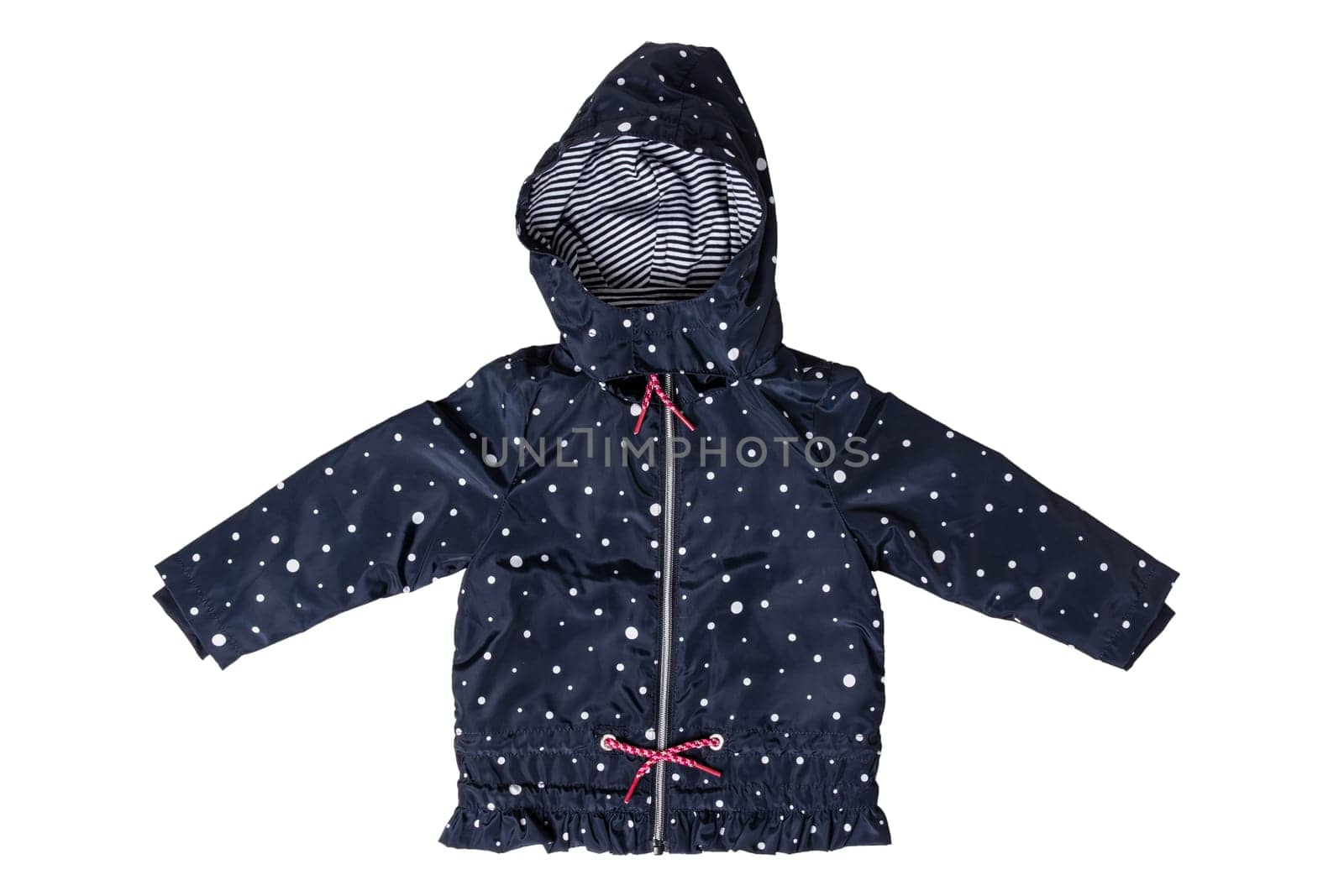 Kids jacket isolated. A stylish fashionable dark blue jacket with white dots and blue white striped lining for the little girl. A rain coat and windbreaker with hood for spring and autumn.