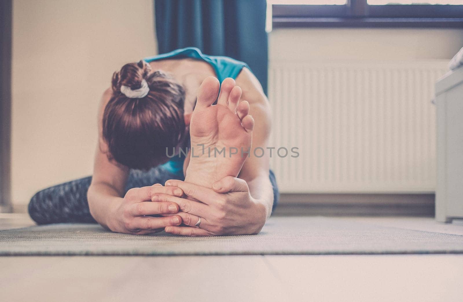 woman doing yoga at home
