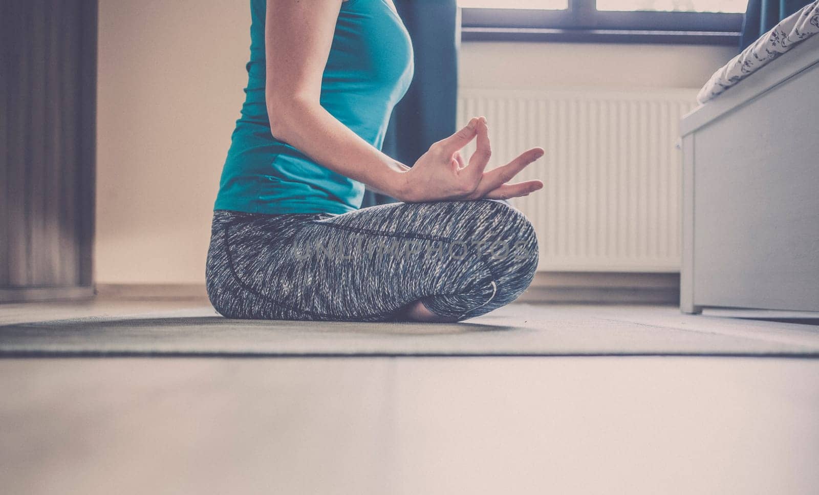 woman doing yoga at home