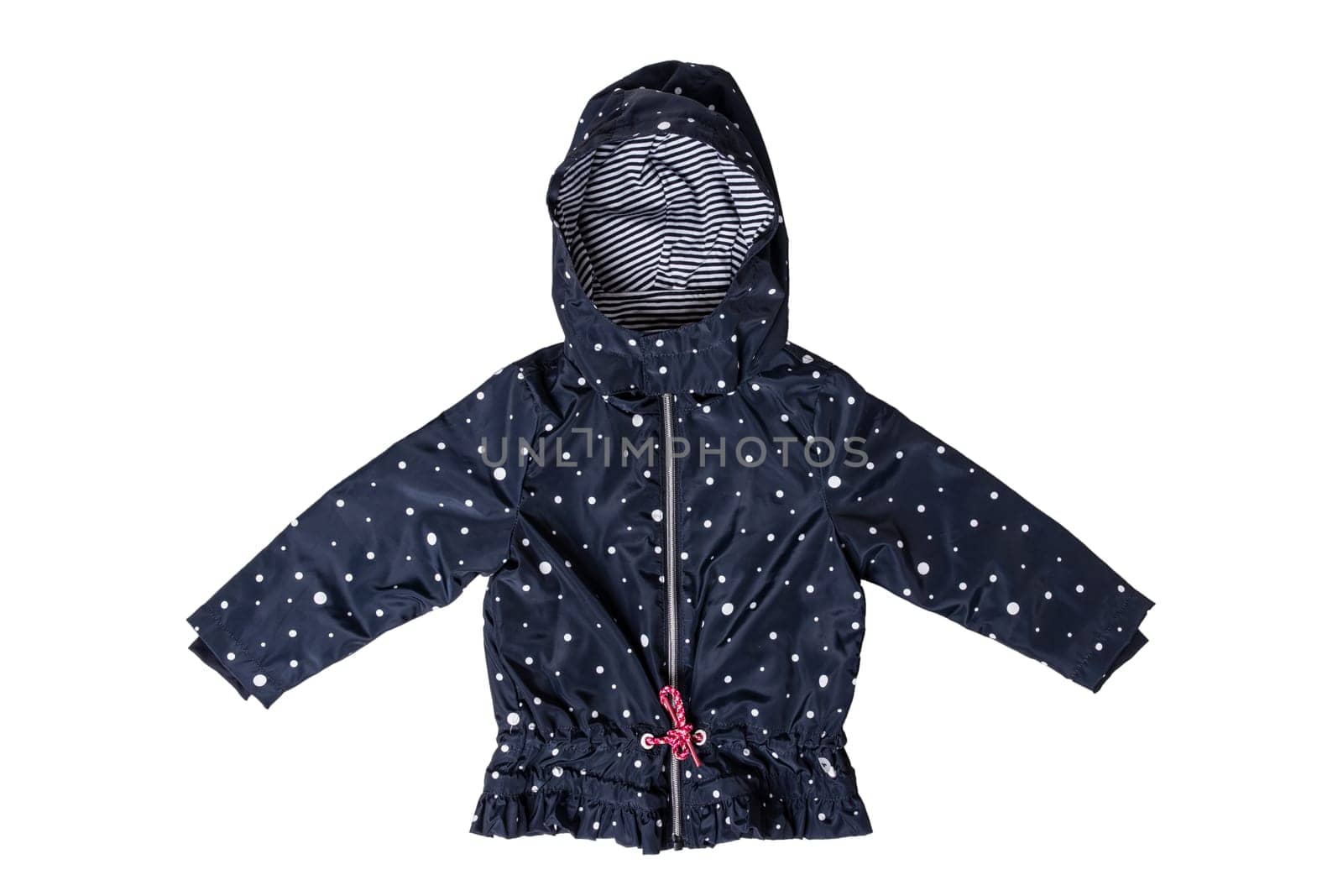 Kids jacket isolated. A stylish fashionable dark blue jacket with white dots and blue white striped lining for the little girl. A rain coat and windbreaker with hood for spring and autumn.