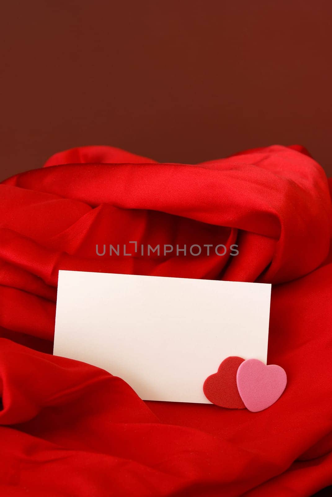 A blank notecard placed within a romantic scene.