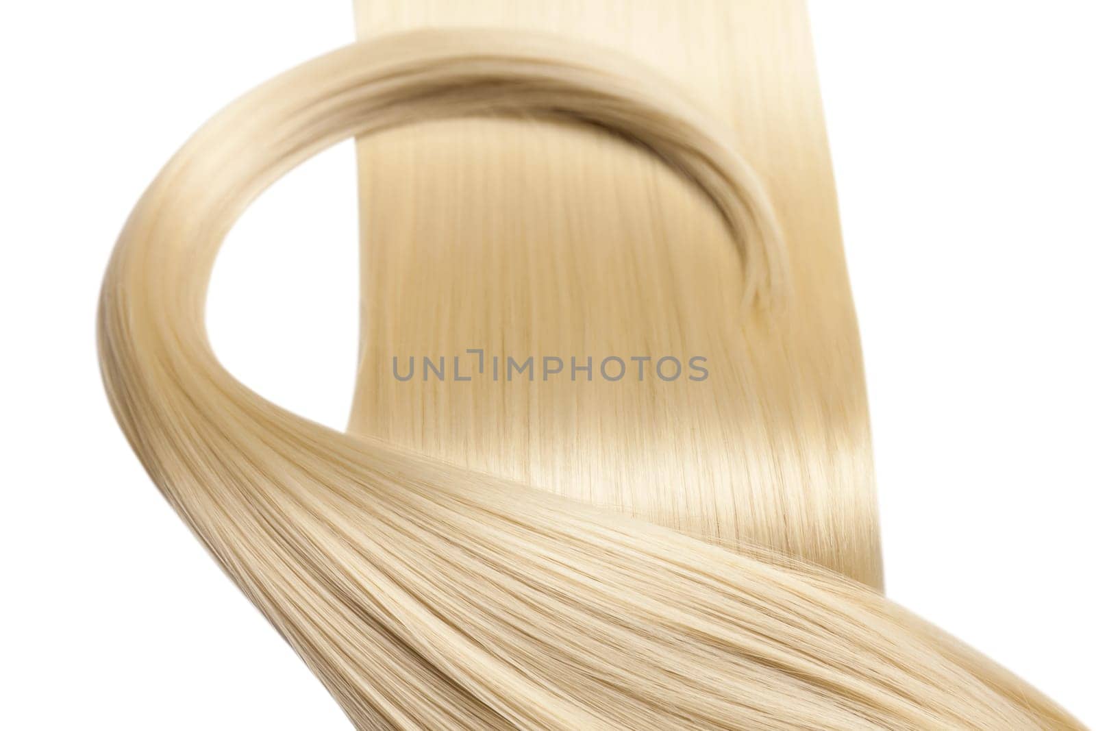 Closeup on luxurious straight glossy blonde hair