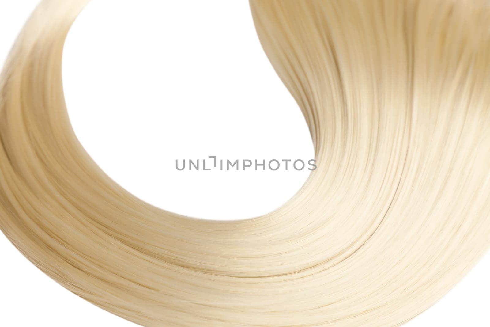 Closeup on luxurious straight glossy blonde hair