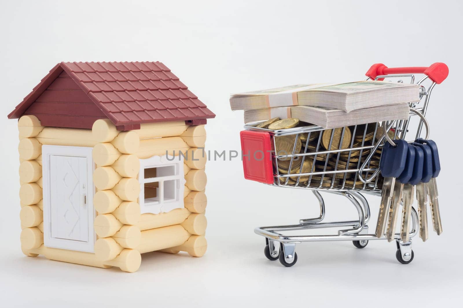 Toy house, trolley with money and a bunch of keys to the house