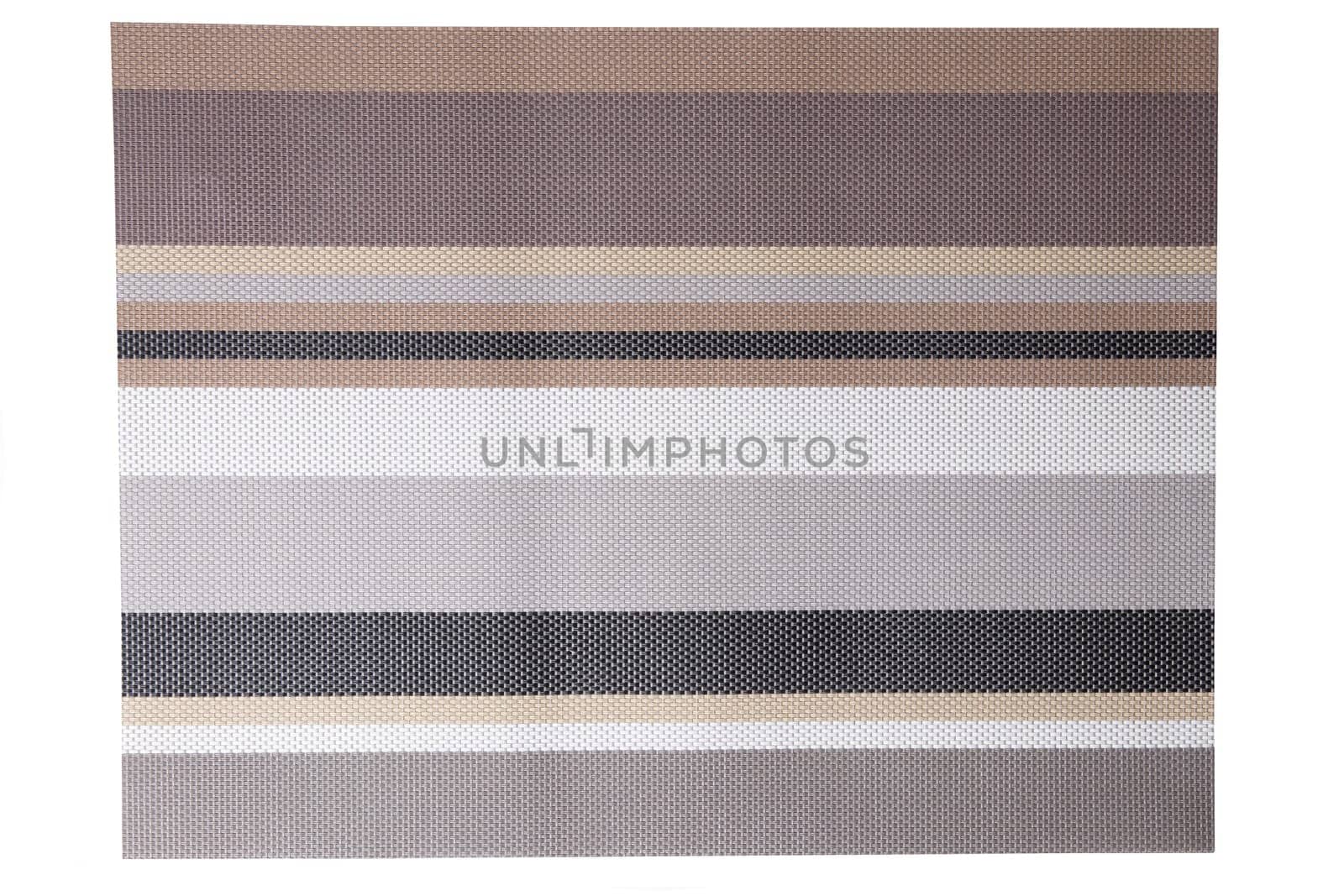 Plastic mats backgrounds. A woven plastic mat with a colorful striped pattern isolated on a white background.