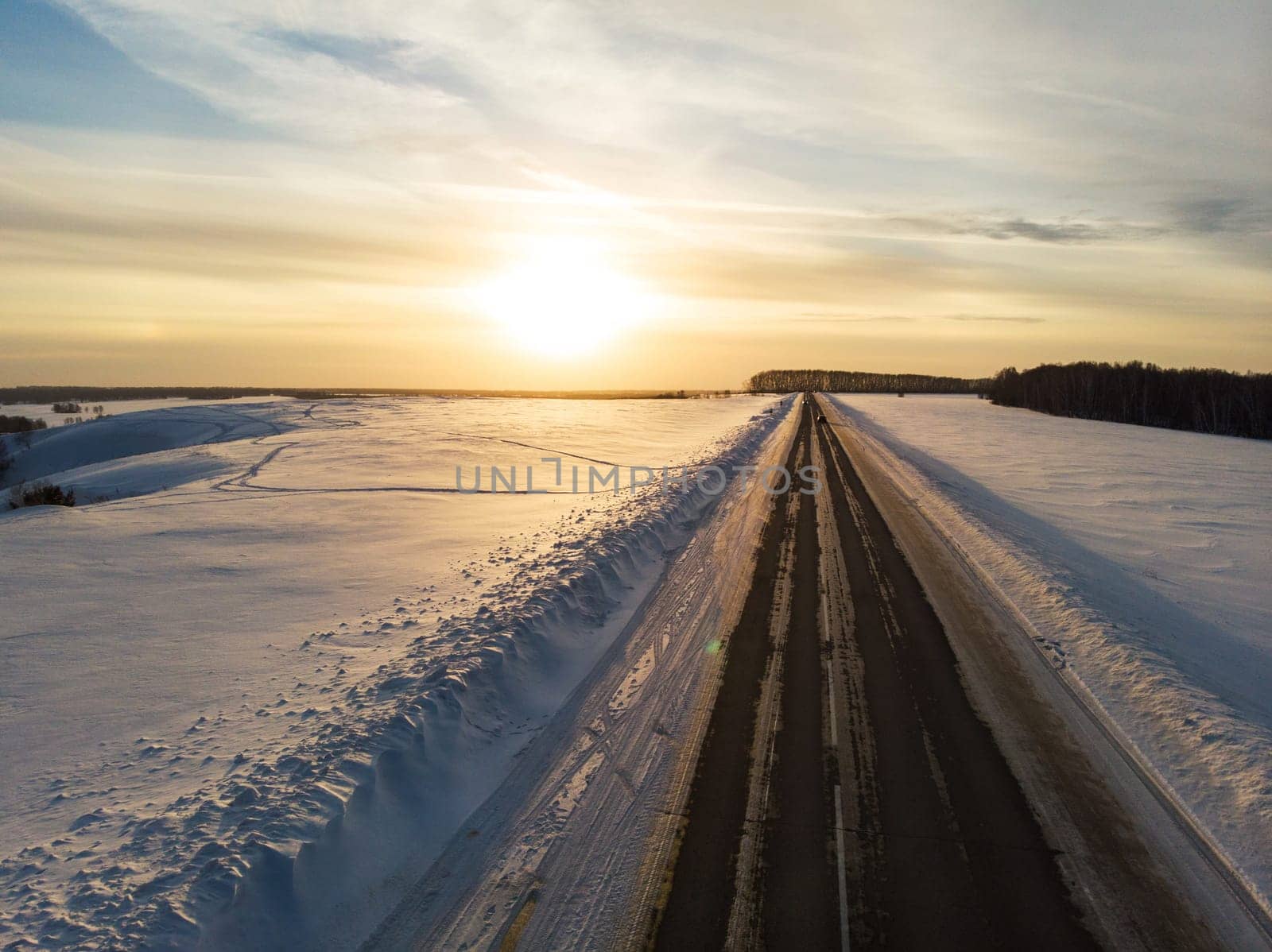 Aerial view of a road in winter landscape