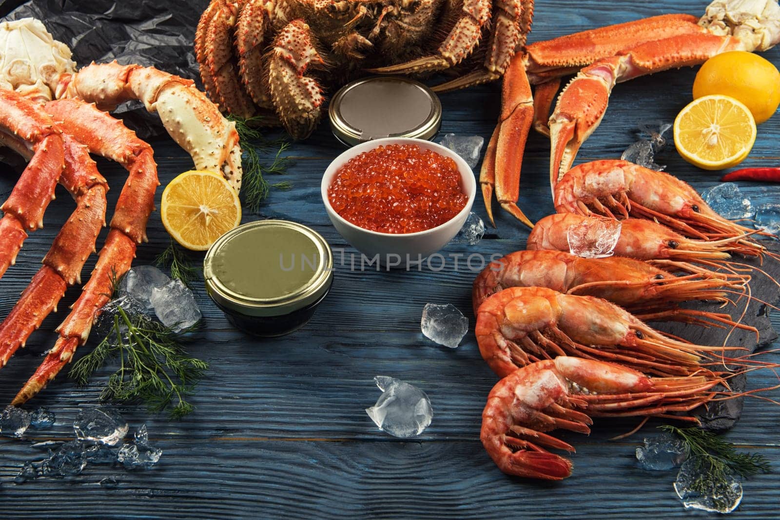 Set of seafood: red and black caviar, limb of hairy crab, limb of snow crab, far eastern kamchatka crab