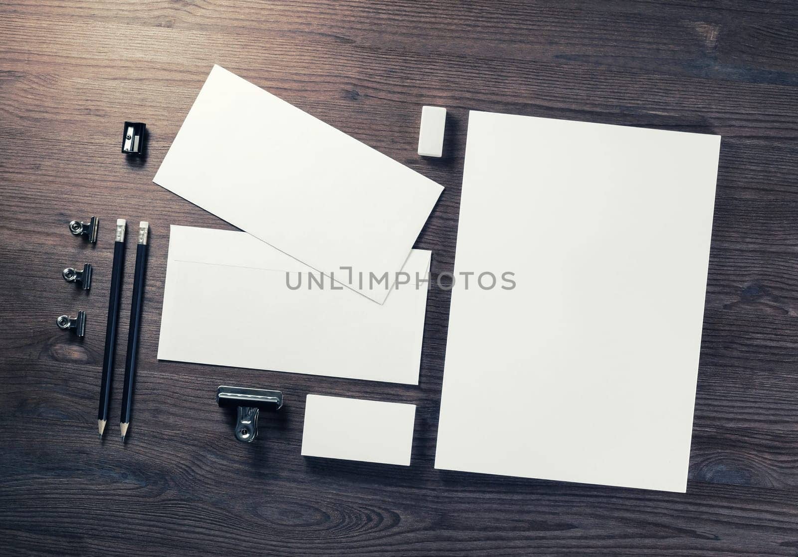 Blank business stationery set on wooden background. Corporate identity template. Branding mock-up. Flat lay.