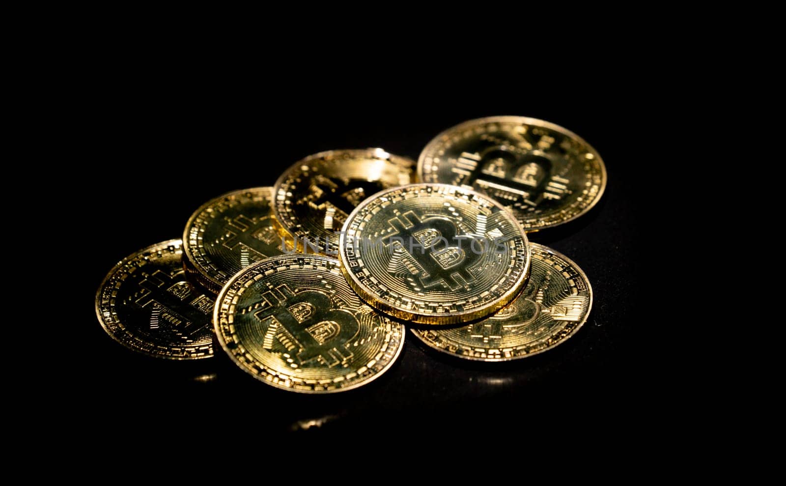 golden bitcoin cryptocurrency in dark background