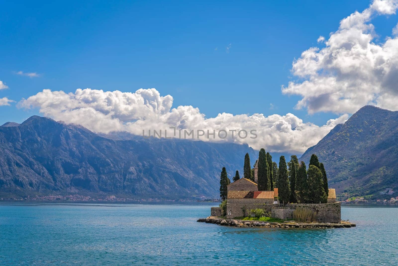 View of the small Church on San George`s island in Kotor bay as seen from the boat sailing away, Montenegro