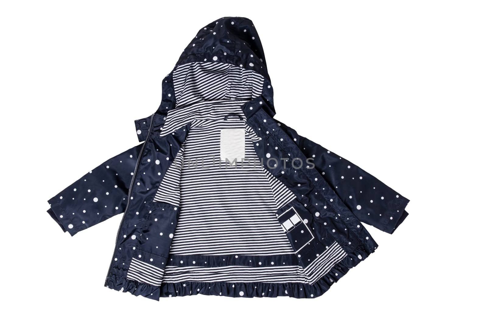 Kids jacket isolated. A stylish fashionable dark blue jacket with white dots and blue white striped lining for the little girl. A rain coat and windbreaker with hood for spring and autumn.