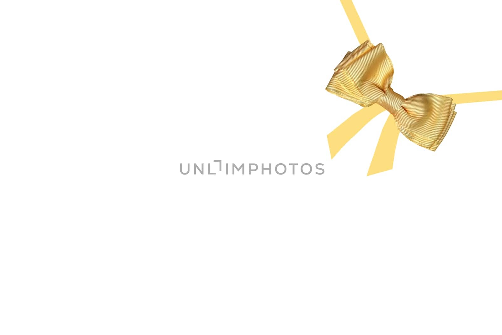 Gift bows. A decorative gold shiny bow made of satin with painted ribbons for gift box isolated on a white background. Decorations background.
