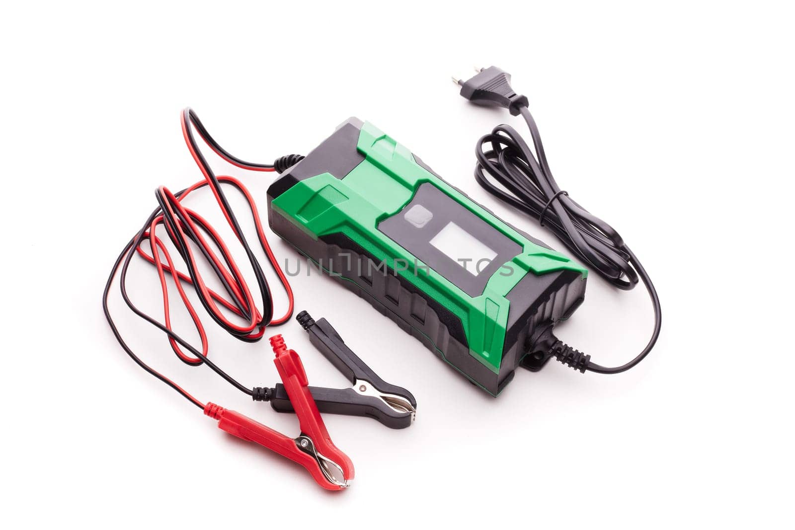 Smart multi purpose battery charger. Car battery charger isolated on a white background. Top view. Concept of service, maintenance, charging car battery, diy