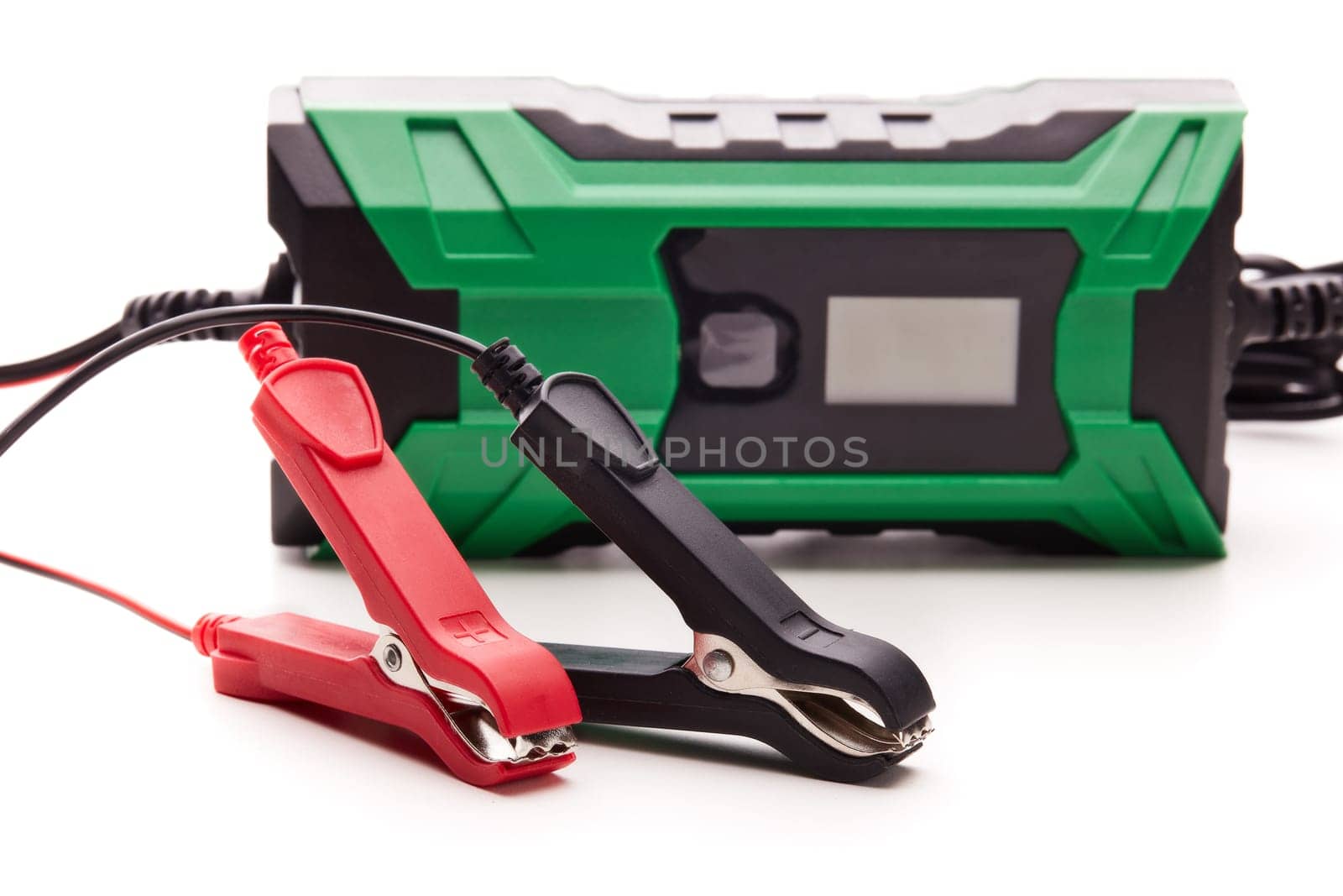 Smart multi purpose battery charger. Car battery charger isolated on a white background. Concept of service, maintenance, charging car battery, diy