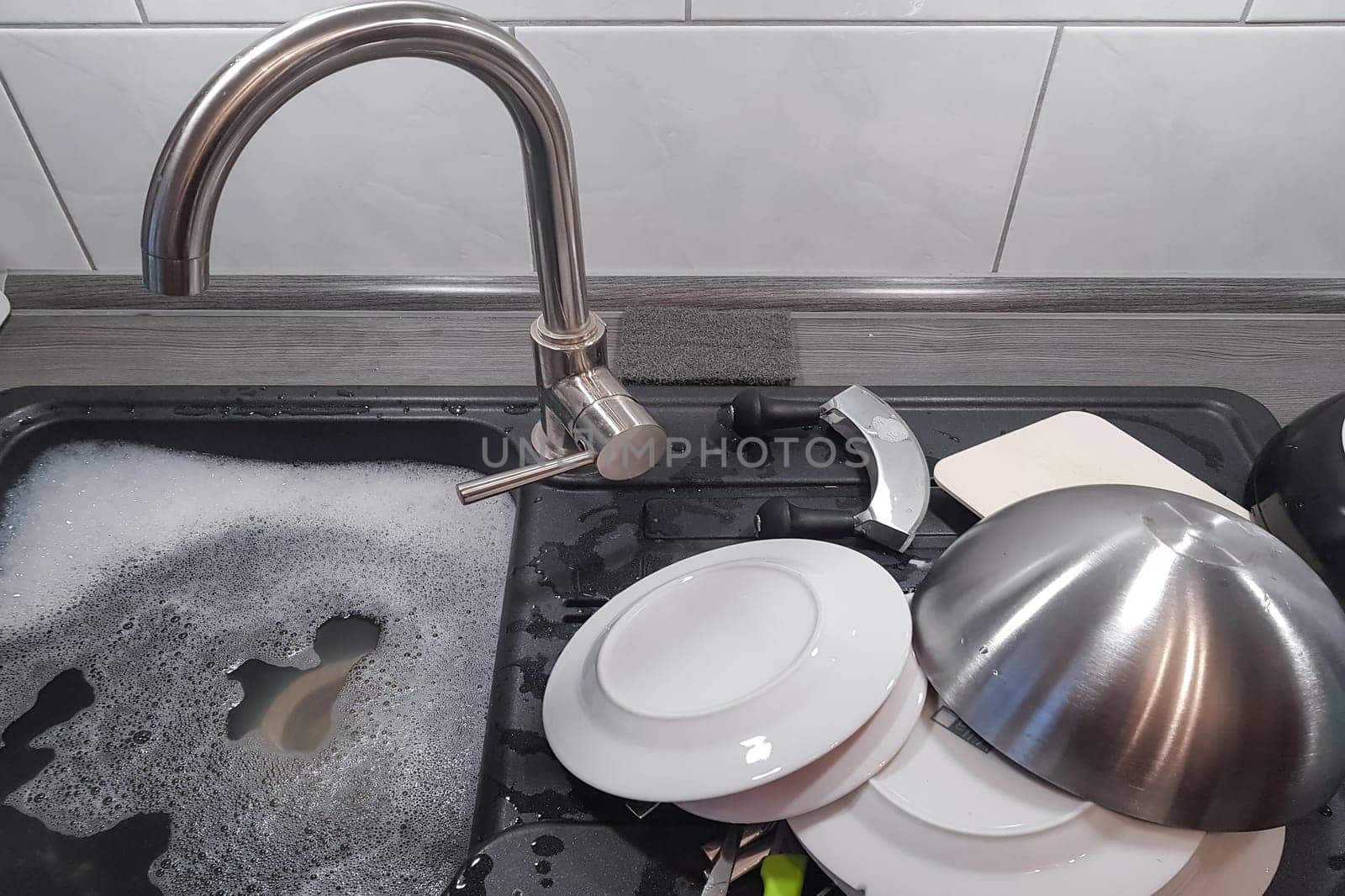 Wash and dry kitchen utensils on the sink by hand