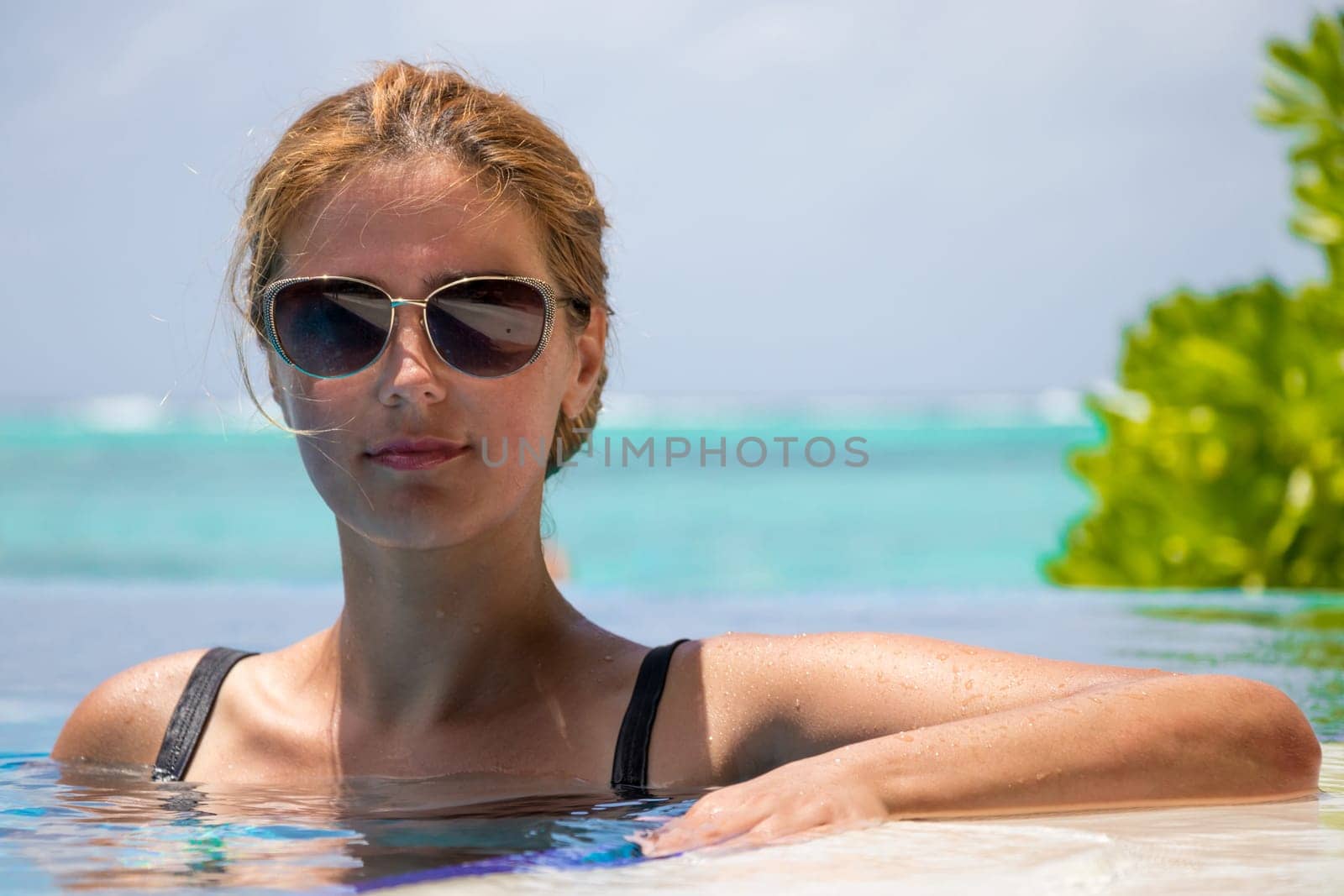 Happy girl in swimming pool